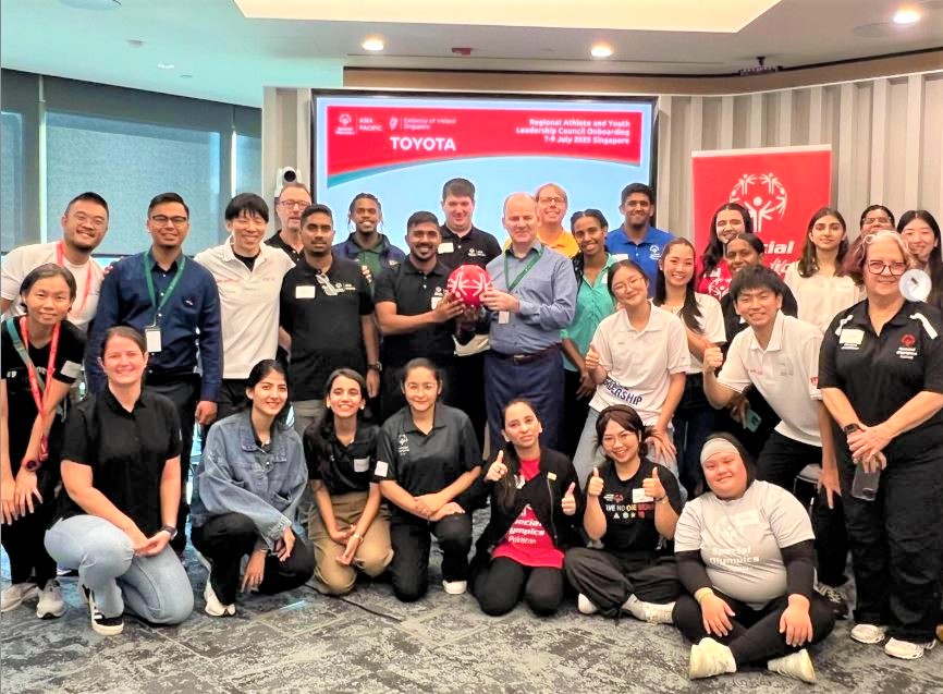 Unified Sports teammates—athletes and partners—celebrating after a match